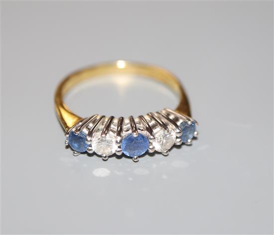 A sapphire and diamond five-stone half-hoop ring, 18ct gold setting, size O, gross weight 3.7 grams.